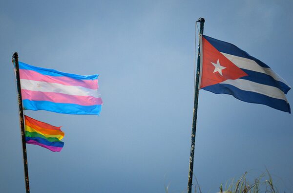 Trans_Pride_and_LGBT_Pride_and_Cuban_flags_flying_insert_by_Yariel_Valdes_Gonzalez(1)